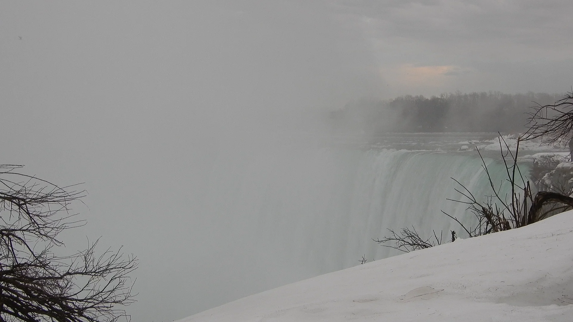 Snow and ice beside Niagara Falls in winter