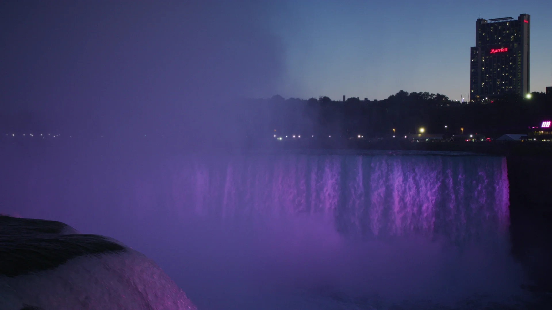 Horseshoe Falls illuminated purple after dark