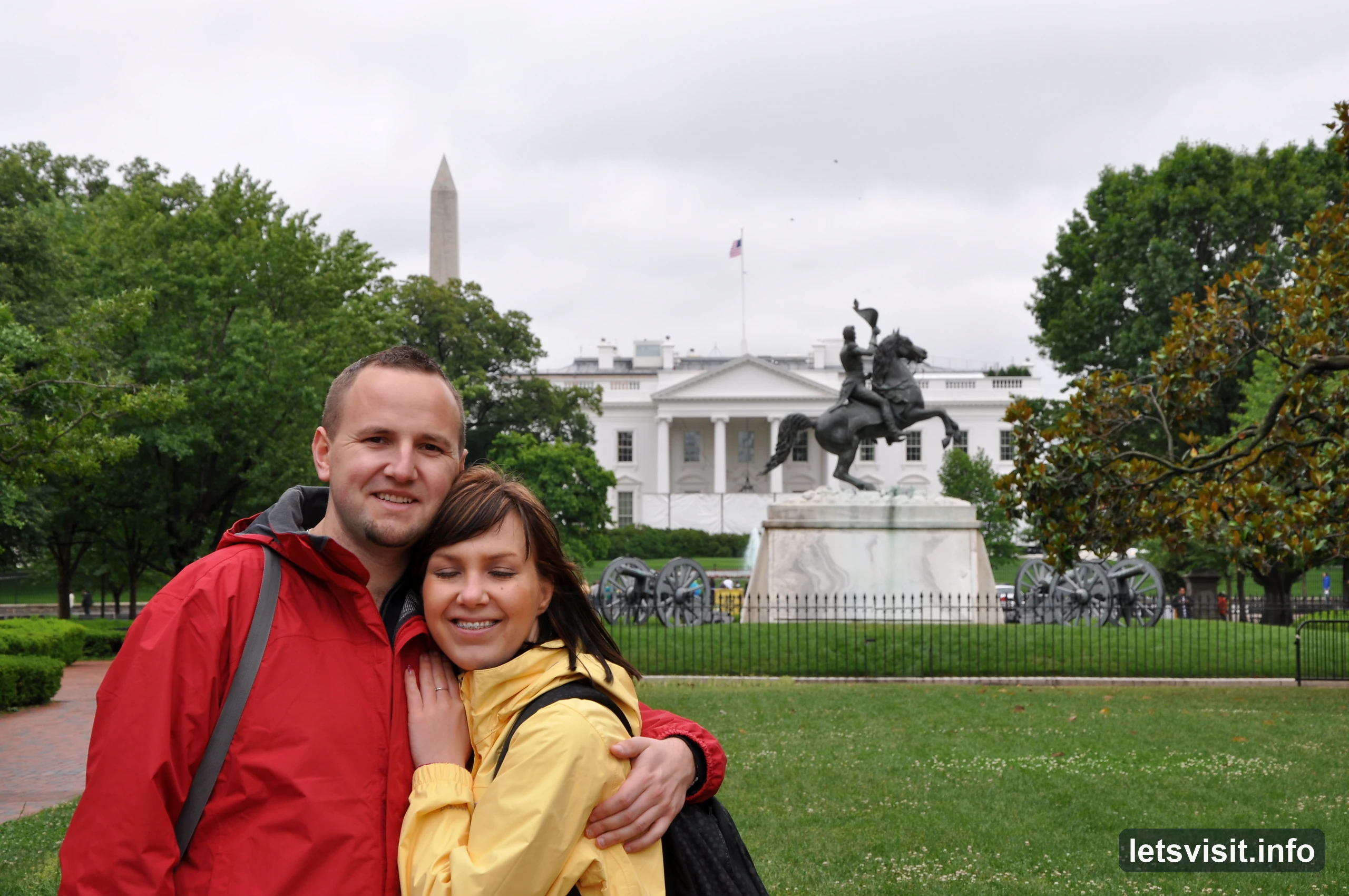 Two travellers in red and yellow jackets in Lafayette Square